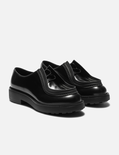Shop Prada Diapason Opaque Brushed Leather Lace-up Shoes In Black