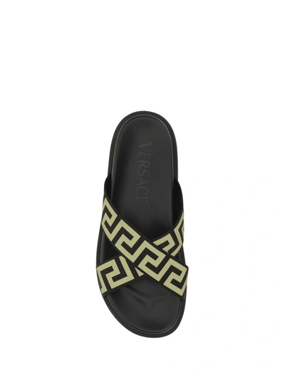 Shop Versace Sandals In Black/gold