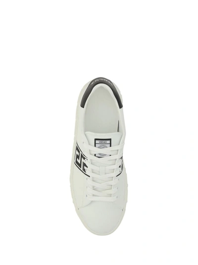 Shop Versace Sneakers In White/black