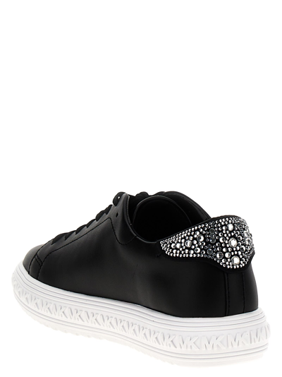 Shop Michael Kors Grive Sneakers In White/black