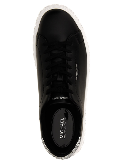 Shop Michael Kors Grive Sneakers In White/black