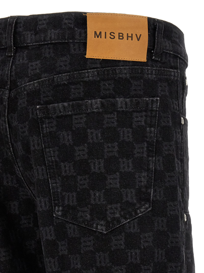 Shop Misbhv Monogram Carpenter Jeans In Black