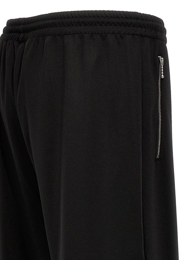 Shop Jw Anderson J.w. Anderson 'bootcut Track' Pants In Black