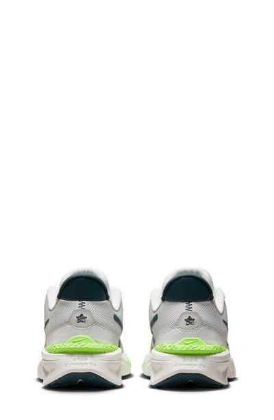 Shop Nike Kids' Star Runner 4 Sneaker In Photon Dust/ Jungle/ White