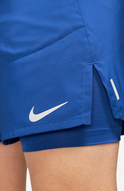 Shop Nike Flex Stride Performance Athletic Shorts In Game Royal/ Game Royal