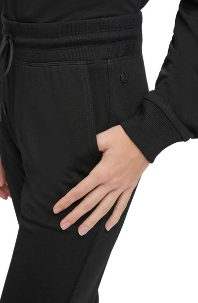 Shop Andrew Marc Sport Cinched Hem Pull-on Pants In Black