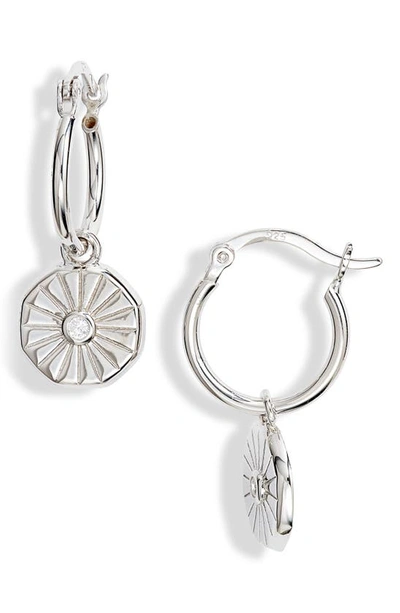 Shop Knotty Crystal Coin Huggie Hoop Earrings In Rhodium
