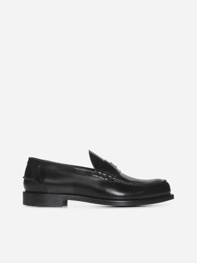 Shop Givenchy 4g Plaque Leather Loafers In Black