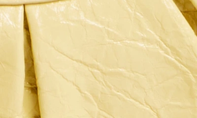 Shop Balenciaga Extra Small Le Cagole Lambskin Shoulder Bag In Butter Yellow