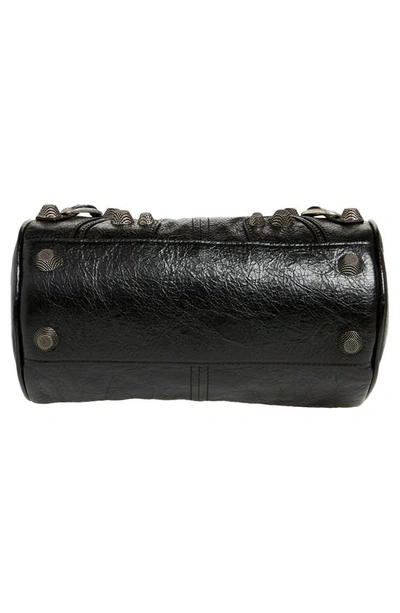 Shop Balenciaga Le Cagole Lambskin Leather Cylinder Crossbody Bag In Black