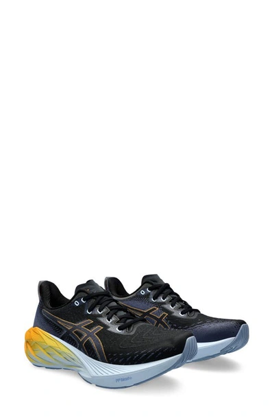 Shop Asics Novablast 4 Running Shoe In Black/ Thunder Blue