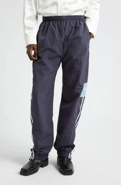 Shop Martine Rose Slim Fit Logo Embroidered Track Pants In Navy/ Blue