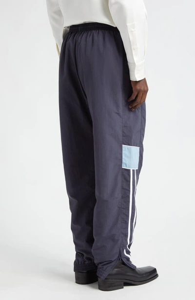 Shop Martine Rose Slim Fit Logo Embroidered Track Pants In Navy/ Blue