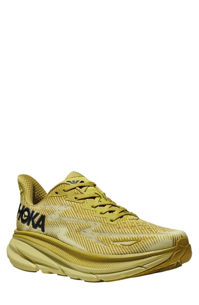 Shop Hoka Clifton 9 Running Shoe In Golden Lichen / Celery Root