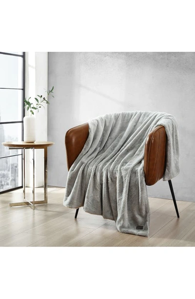 Shop Kenneth Cole Faux Fur Reversible Throw In Grey