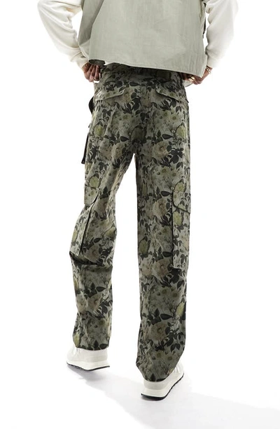 Shop Asos Design Floral Print Baggy Cargo Pants In Medium Green