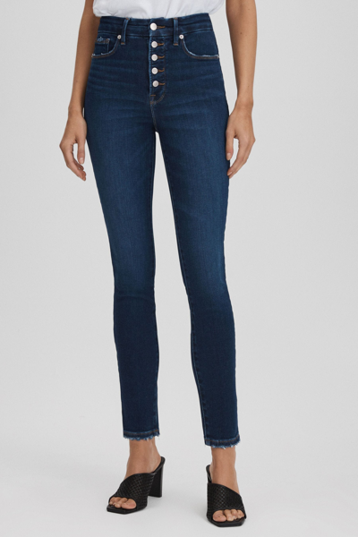 Shop Good American Indigo  Exposed Buttons Skinny Jeans