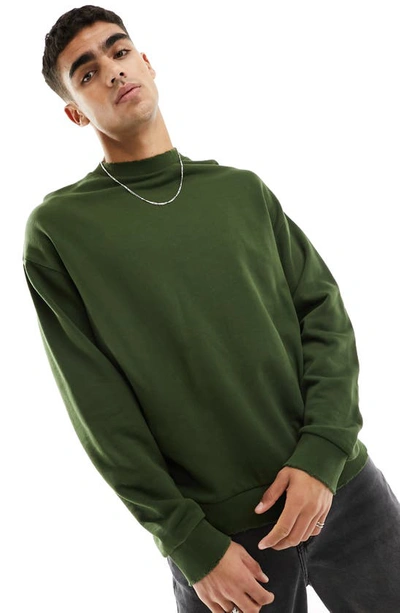 Shop Asos Design Oversize Distressed Sweatshirt In Khaki Green