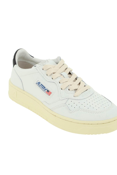 Shop Autry Leather Medalist Low Sneakers In White,black
