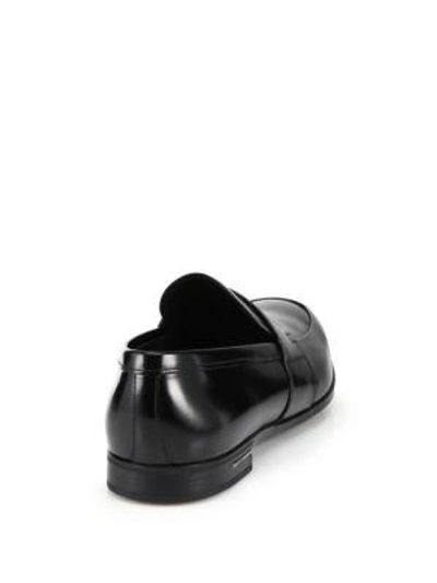 Shop Prada Spazzolato Leather Penny Loafers In Black