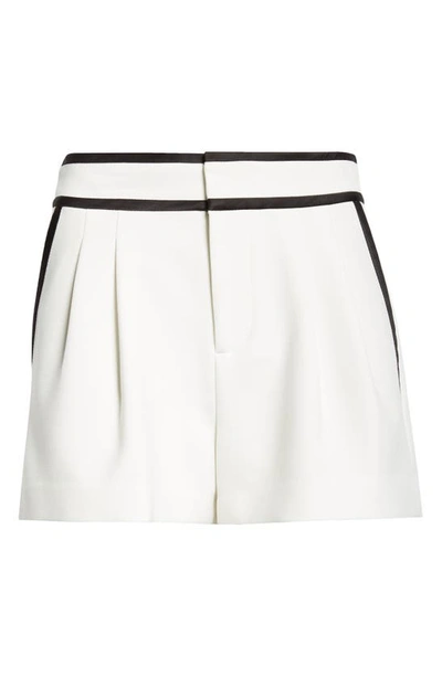 Shop Alice And Olivia Esta Contrast Trim Pleated Shorts In Off White