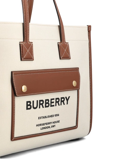Shop Burberry Handbags In Natural/tan
