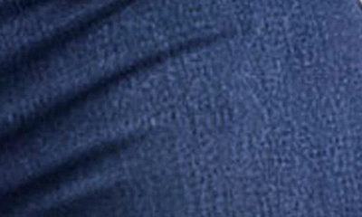Shop Asos Design Power Stretch High Waist Flare Jeans In Dark Blue