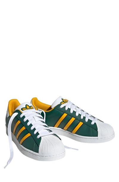 Shop Adidas Originals Superstar Lifestyle Sneaker In Green/ Crew Yellow/ White