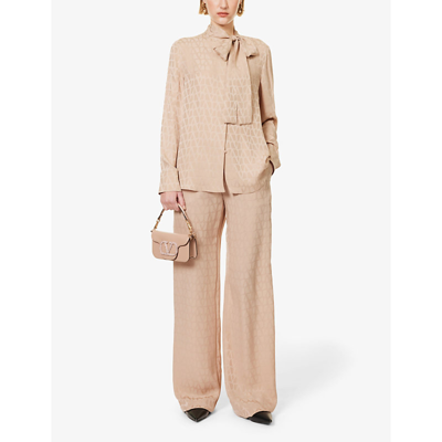 Shop Valentino Monogram-pattern Relaxed-fit Straight-leg Mid-rise Silk Trousers In Cream