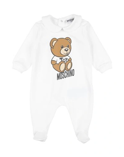 Shop Moschino Baby Newborn Baby Jumpsuits & Overalls White Size 3 Cotton, Elastane