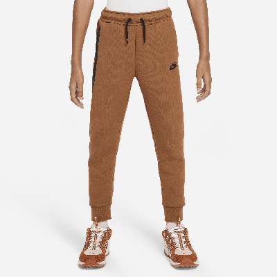 Shop Nike Sportswear Tech Fleece Big Kids' (boys') Pants In Brown