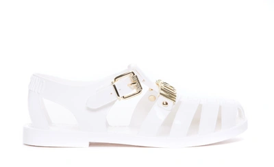 Shop Moschino Sandals In White