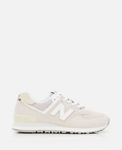 Shop New Balance U574 Sneakers In White