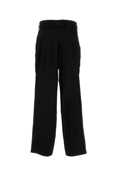 Amiri Wide Leg Pleated Trousers With Expandable Sides
