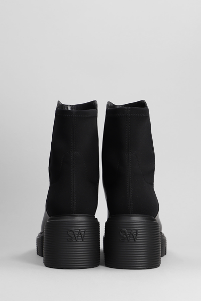Shop Stuart Weitzman 5050 Soho Bootie Combat Boots In Black Leather