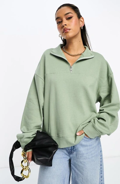 Shop Asos Design Washed Half Zip Sweatshirt In Mid Green