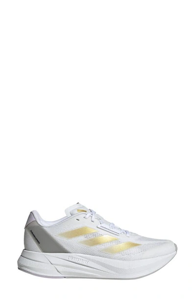 Shop Adidas Originals Duramo Speed Running Sneaker In White/ Gold Met./dawn