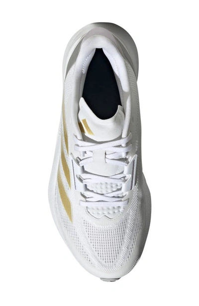 Shop Adidas Originals Duramo Speed Running Sneaker In White/ Gold Met./dawn