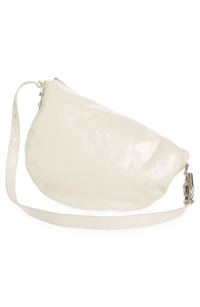 Shop Burberry Medium Knight Asymmetric Crinkle Leather Shoulder Bag In Soap