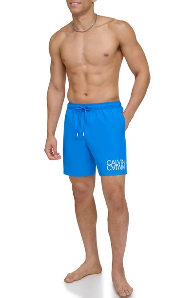 Shop Calvin Klein Reflection Logo Upf 40+ Swim Trunks In Blue