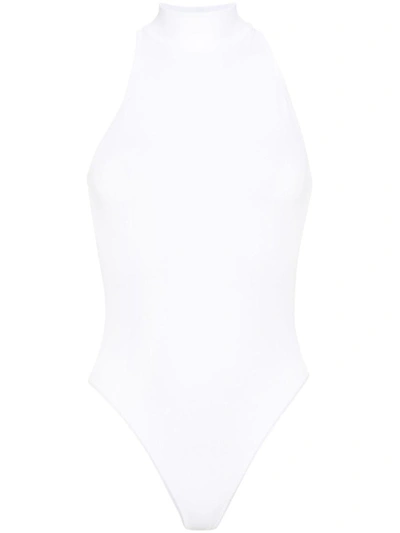 Shop Alaïa Sleeveless Turtleneck Bodysuit In White