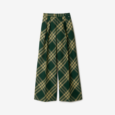 Shop Burberry Pleated Check Wool Trousers In Primrose