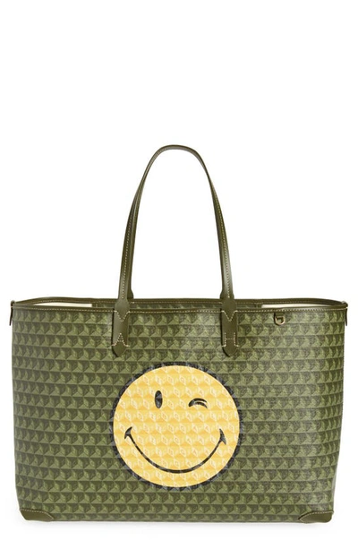 Shop Anya Hindmarch X Smiley® I Am A Plastic Bag Wink Recycled Coated Canvas Tote In Fern/ Olive