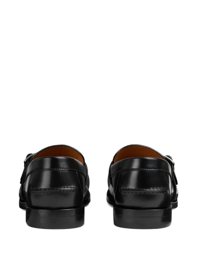 Shop Gucci Gg Motif Leather Loafers In Black