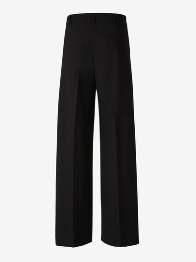 Shop Valentino Tailored Wool Pants In Black