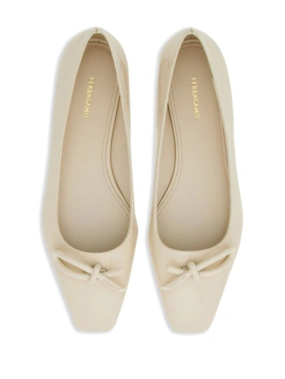 Shop Ferragamo Flat Shoes In White