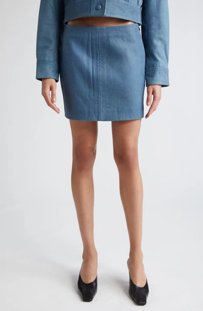 Shop Stand Studio Perla Denim Look Leather Miniskirt In Washed Indigo