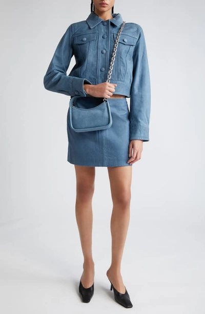 Shop Stand Studio Perla Denim Look Leather Miniskirt In Washed Indigo