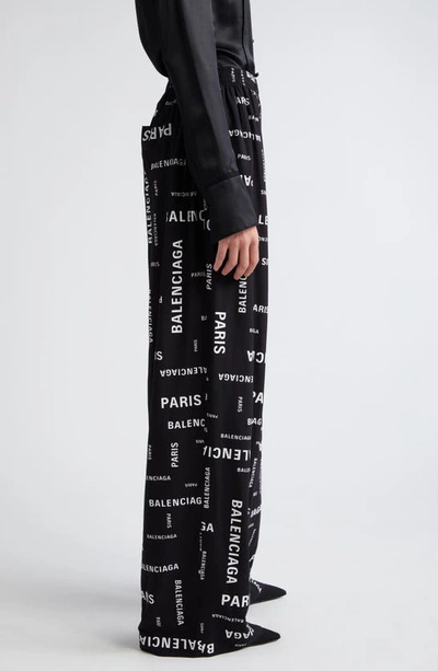 Shop Balenciaga Paris Print Wide Leg Pants In Black/ White