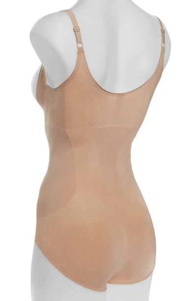 Shop Spanxr Oncore Open Bust Shaper Bodysuit In Soft Nude